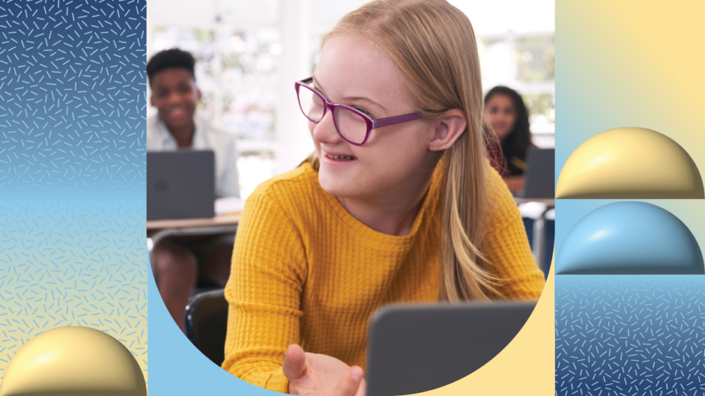 A student using a laptop in a classroom.