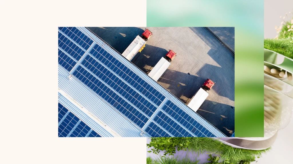 View above three semi trucks parked at a warehouse with solar panels on the roof.