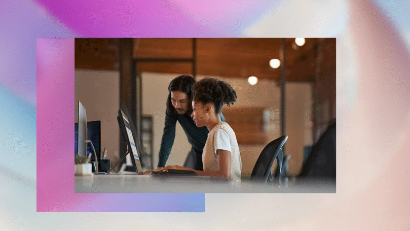 Enterprise office workers collaborating in an open work space.
