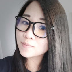 a close up of a woman wearing glasses